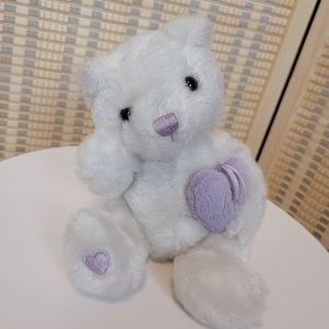 Plush White bear holding a purple heart that says love